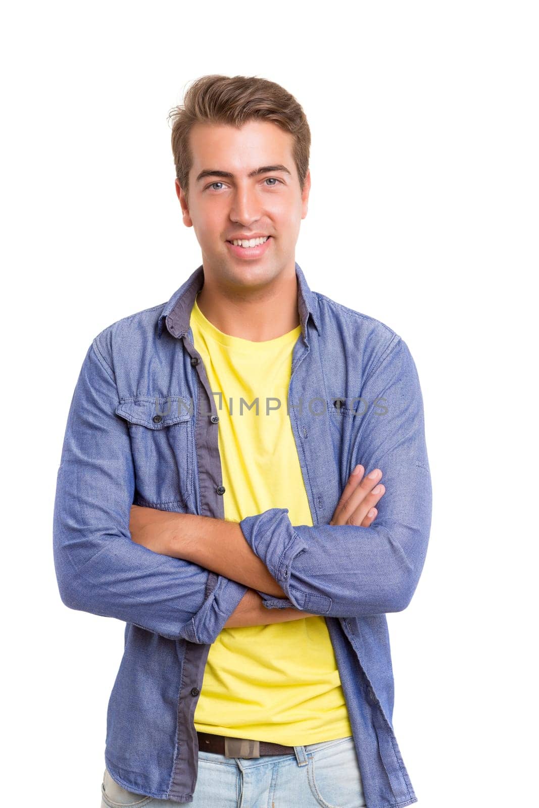 Studio picture of a young and handsome man posing isolated