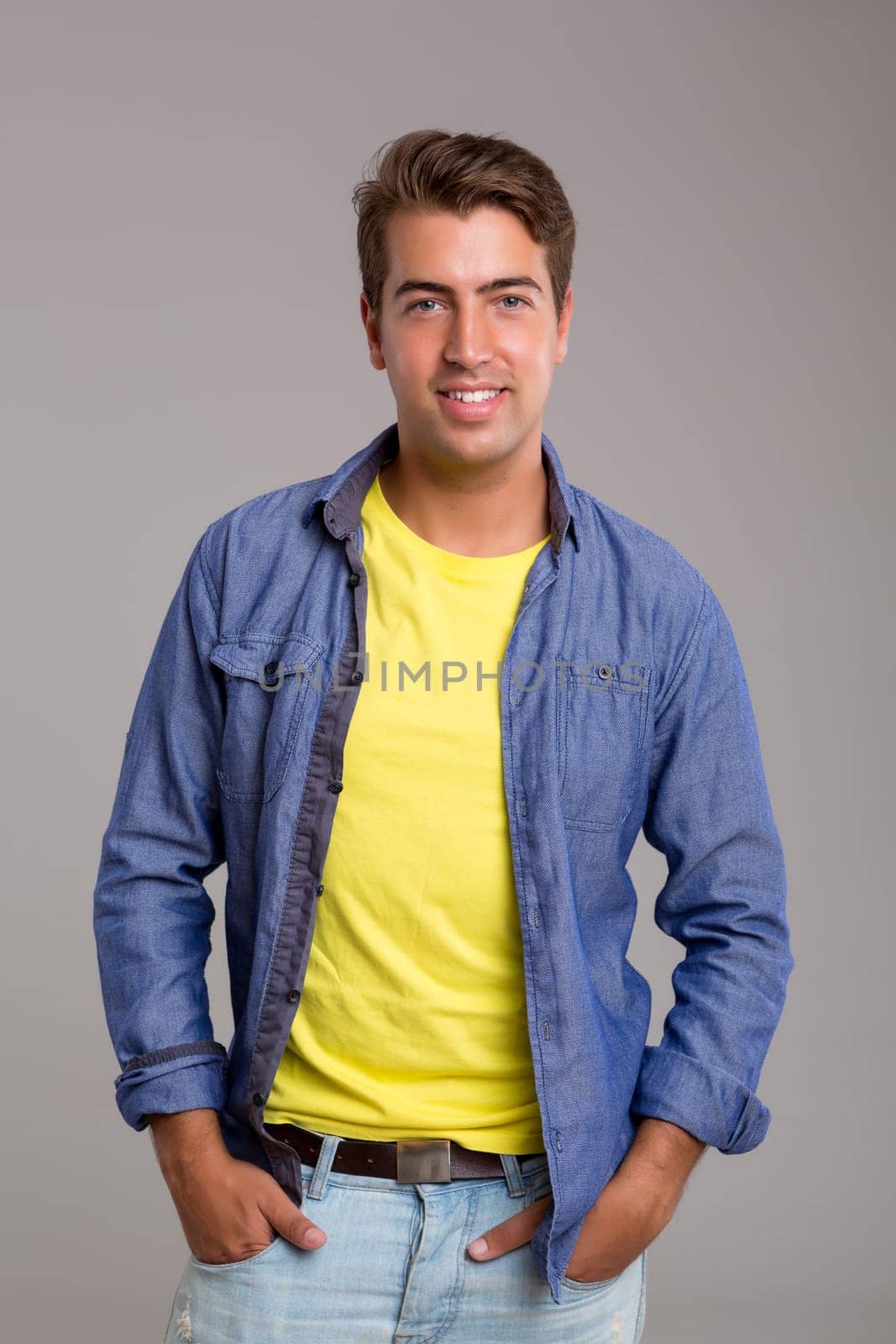 Studio picture of a young and handsome man posing isolated