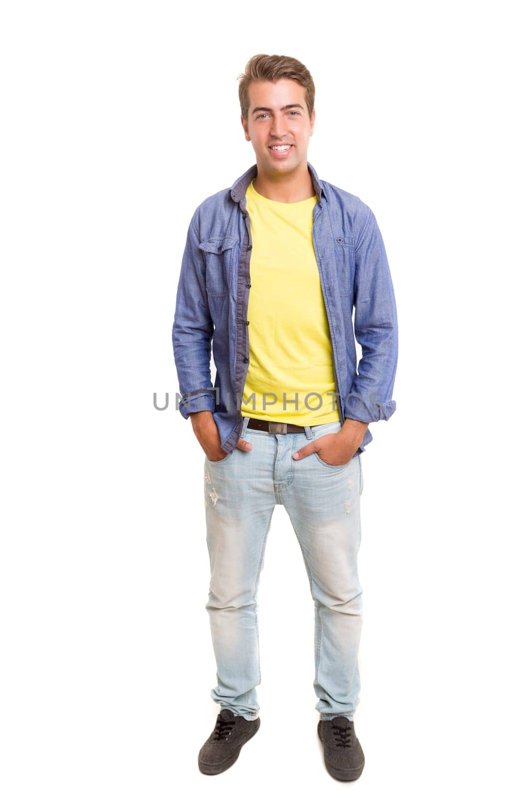 Studio picture of a young and handsome man posing isolated