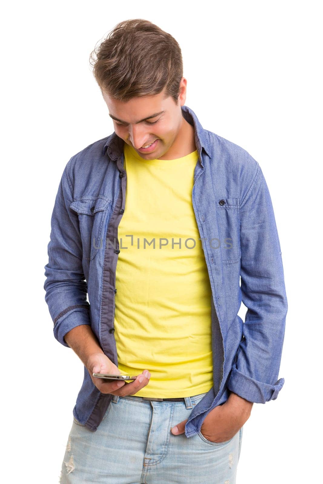 Young man at the phone, isolated over white