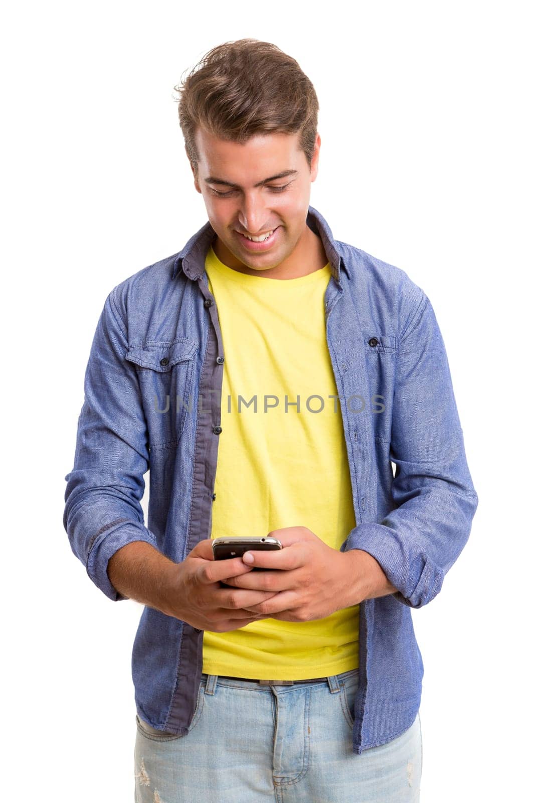Young man at the phone, isolated over white