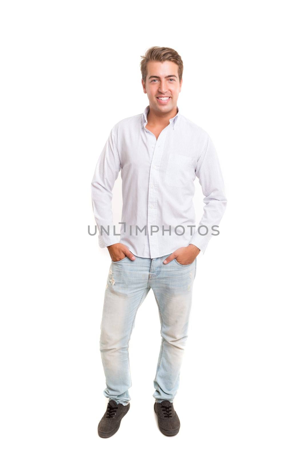 Studio picture of a young and handsome man posing isolated