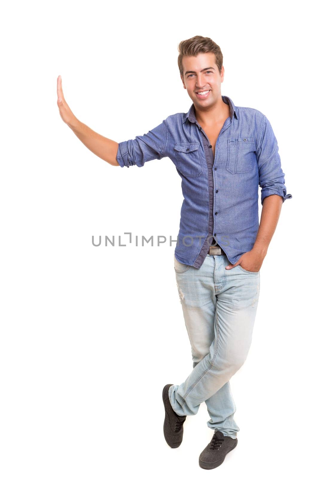 Young man presenting your product, isolated over a white background