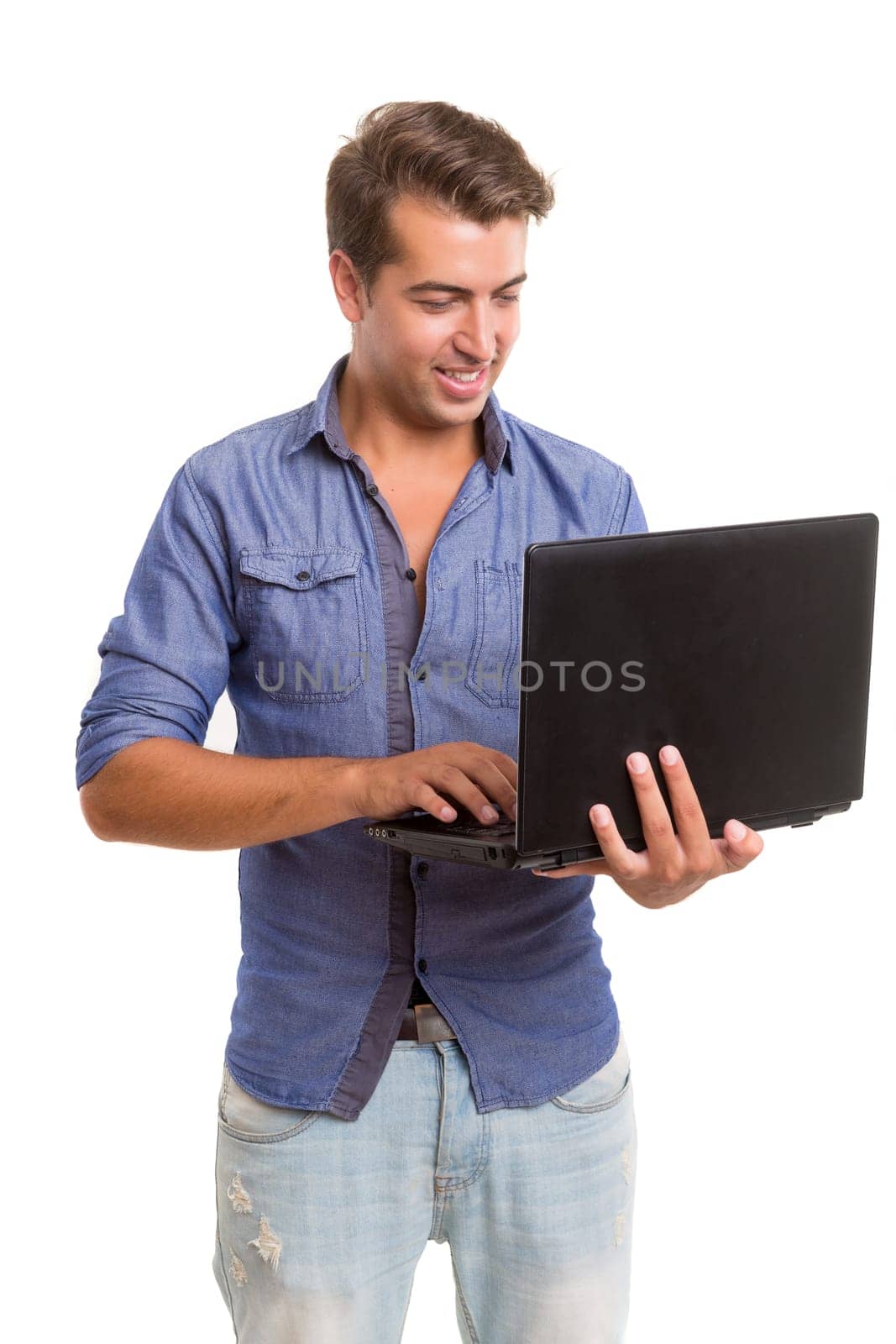 Young handsome man working with laptop computer