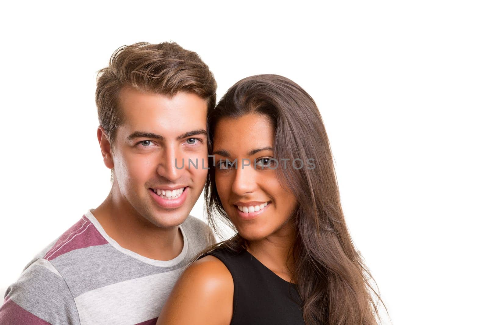 Young couple posing isolated in studio