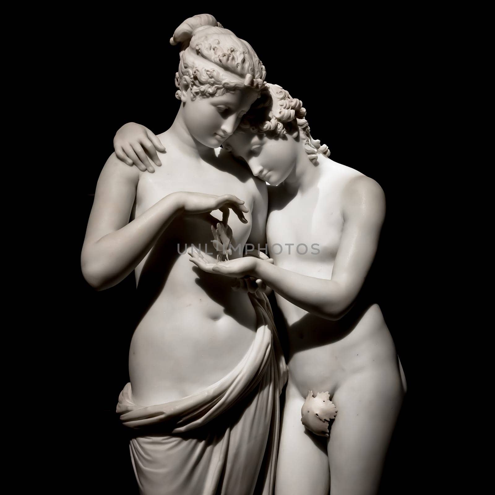 MILAN, ITALY - June 2020. Antonio Canova's masterpiece Cupid and Psyche (Amore e psiche, 1797), symbol of eternal love. Psyche raises Cupid left hand with her own, to place a butterfly on his palm. The butterfly symbolizes her soul, which she offers in all innocence to Cupid.