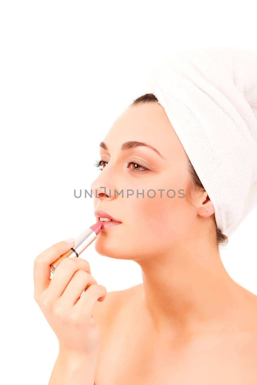 Beautiful young woman with a perfect skin, isolated over white background