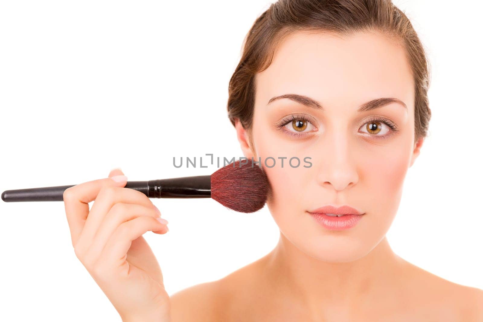Beautiful young woman with a perfect skin, isolated over white background