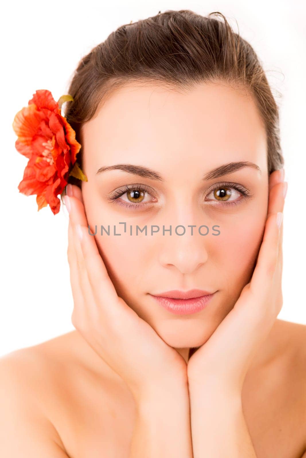 Beautiful young woman with a perfect skin, isolated over white background