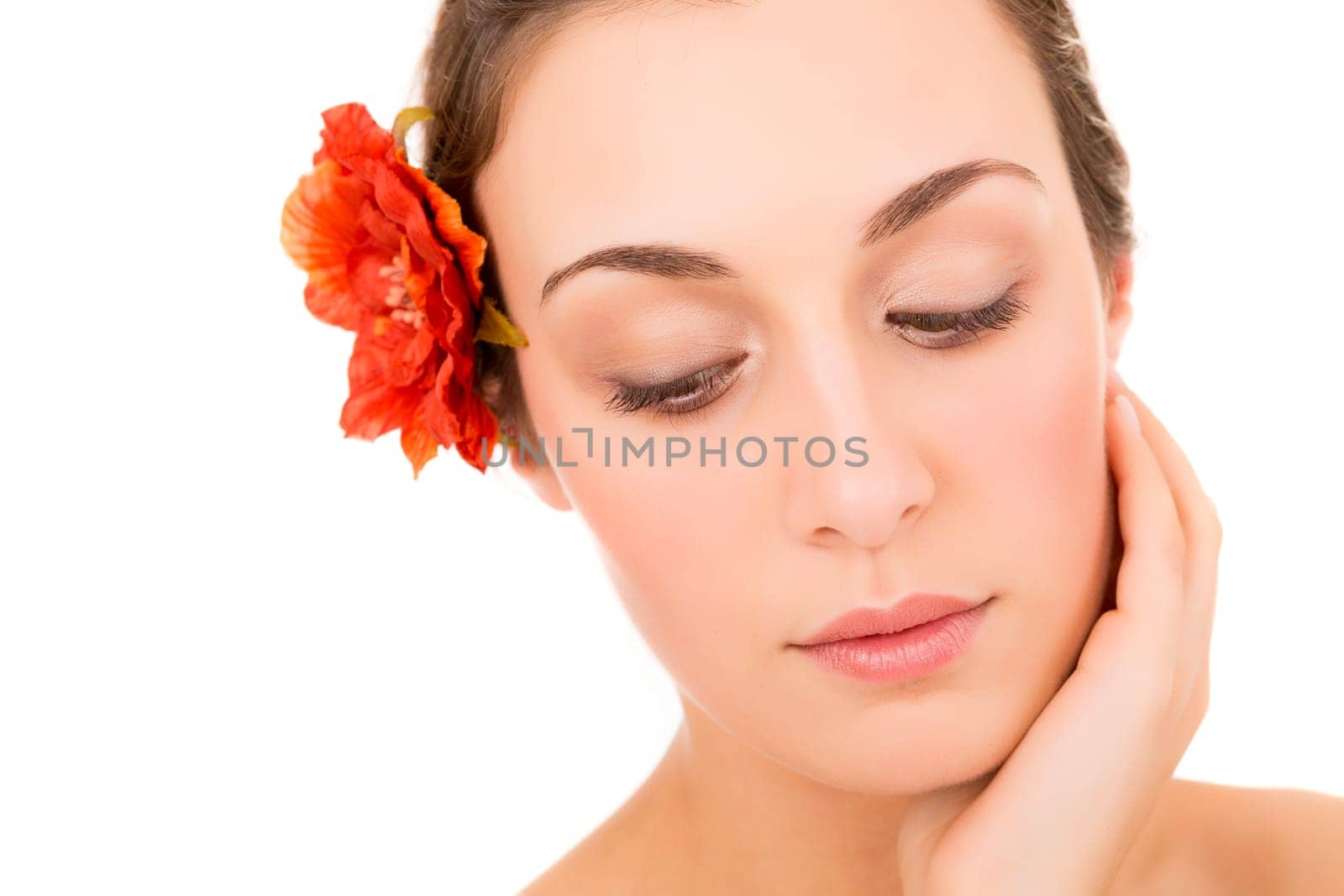 Beautiful young woman with a perfect skin, isolated over white background