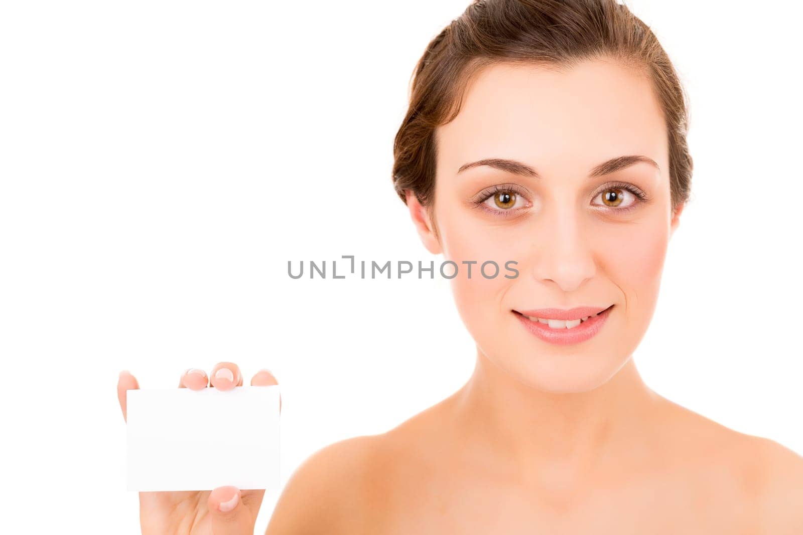 Beautiful fresh woman taking white card - blank. Dressing in pure white background