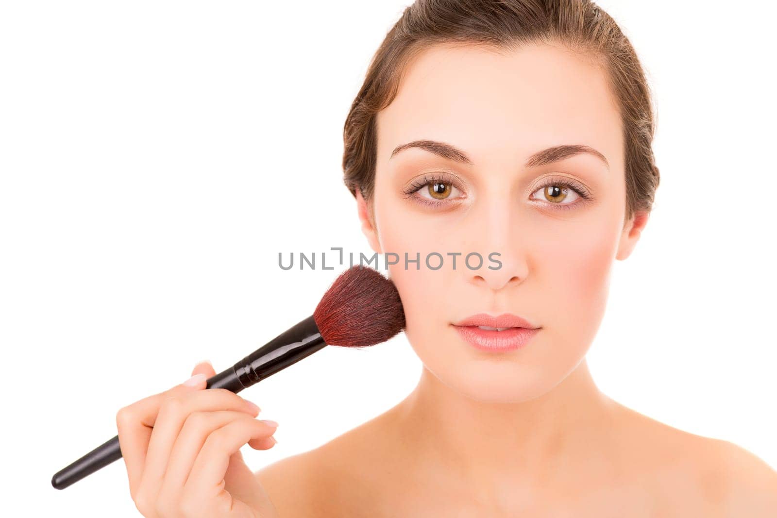 Beautiful young woman with a perfect skin, isolated over white background