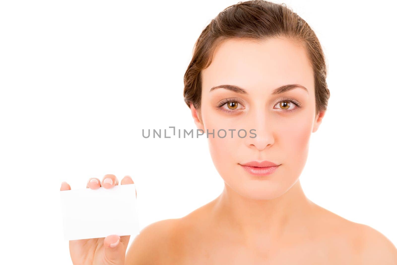 Beautiful fresh woman taking white card - blank. Dressing in pure white background