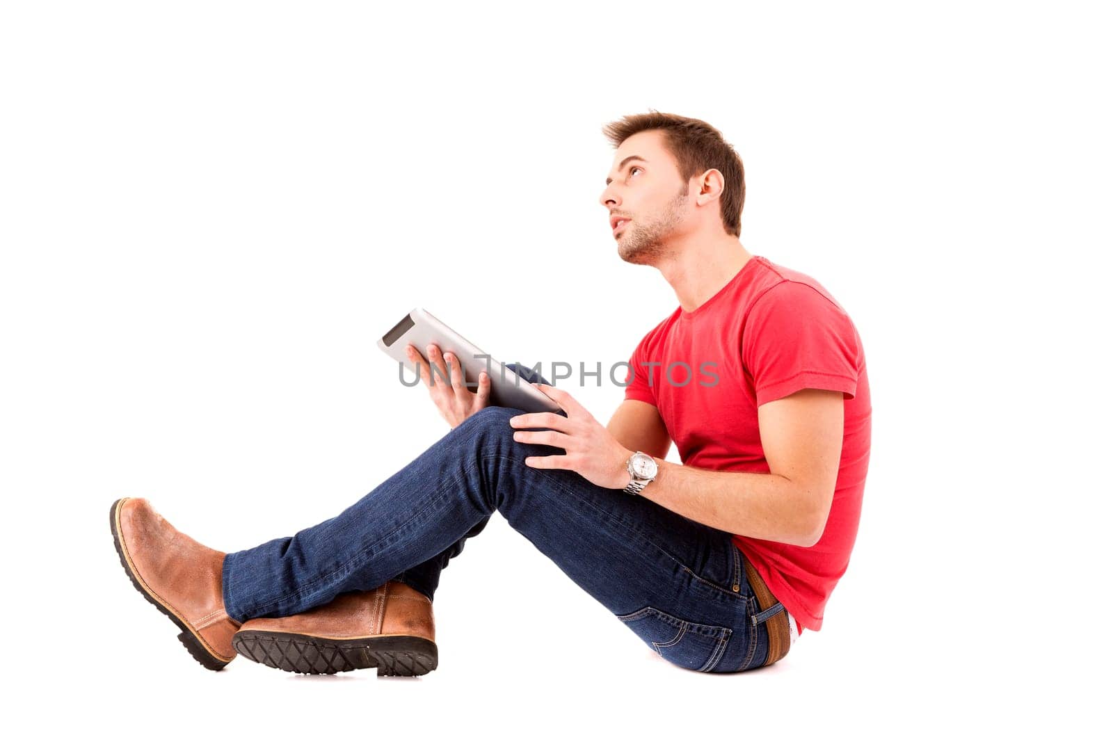 Young happy student working with a new digital tablet computer, isolated