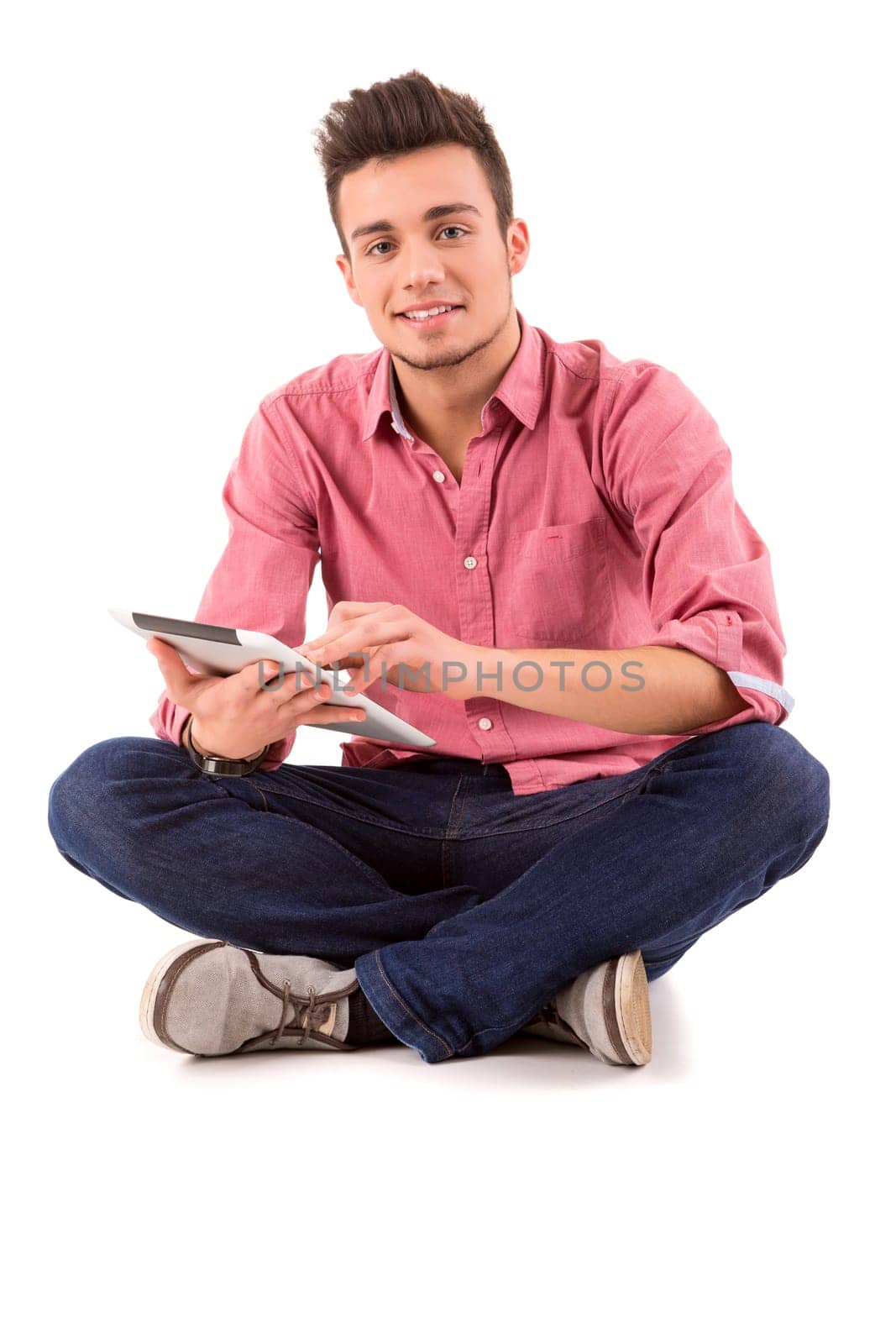 Young happy student working with a new digital tablet computer, isolated