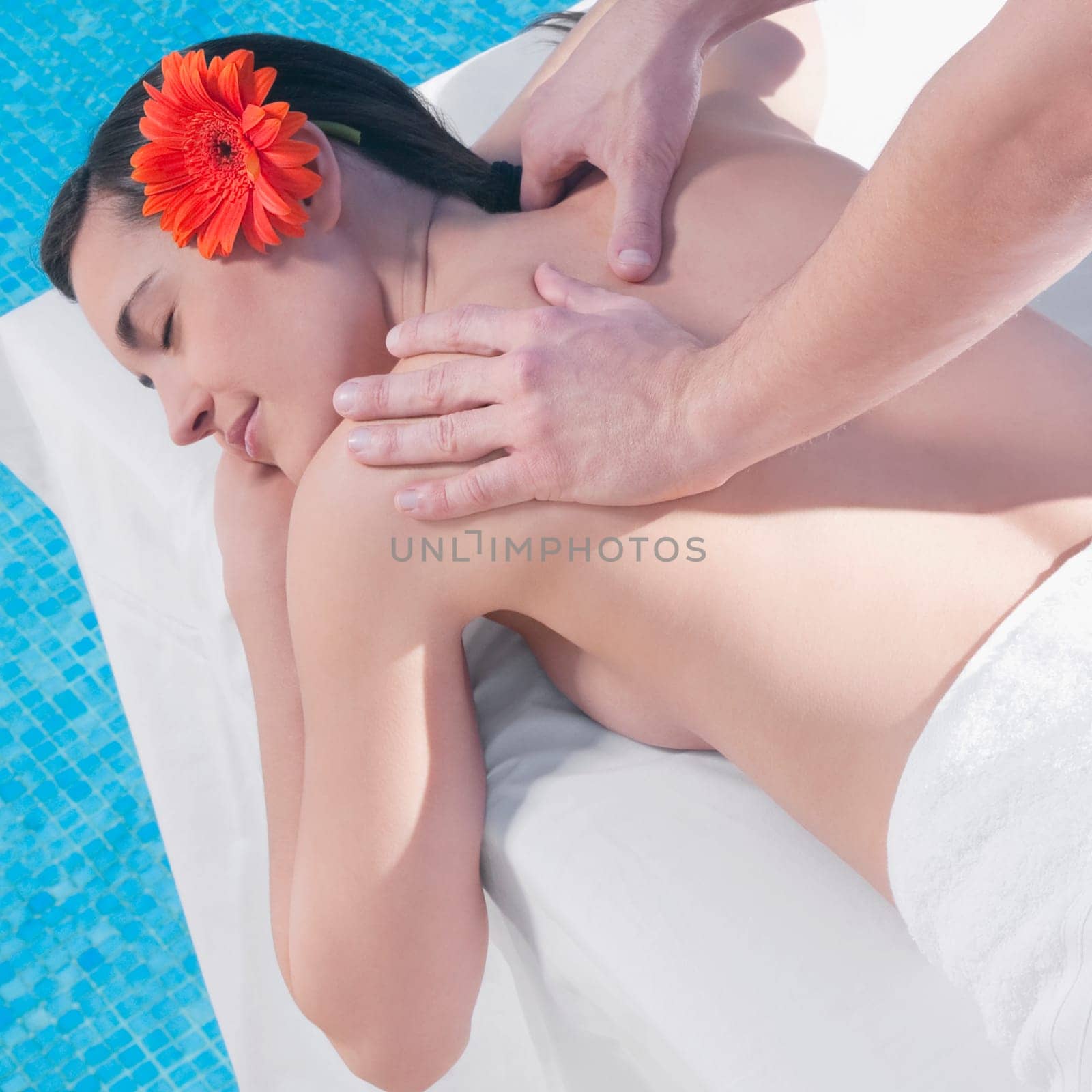 Woman receiving back massage from a massage therapist