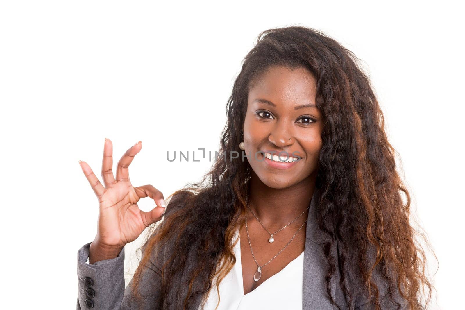 Beautiful young woman signaling ok, isolated over white