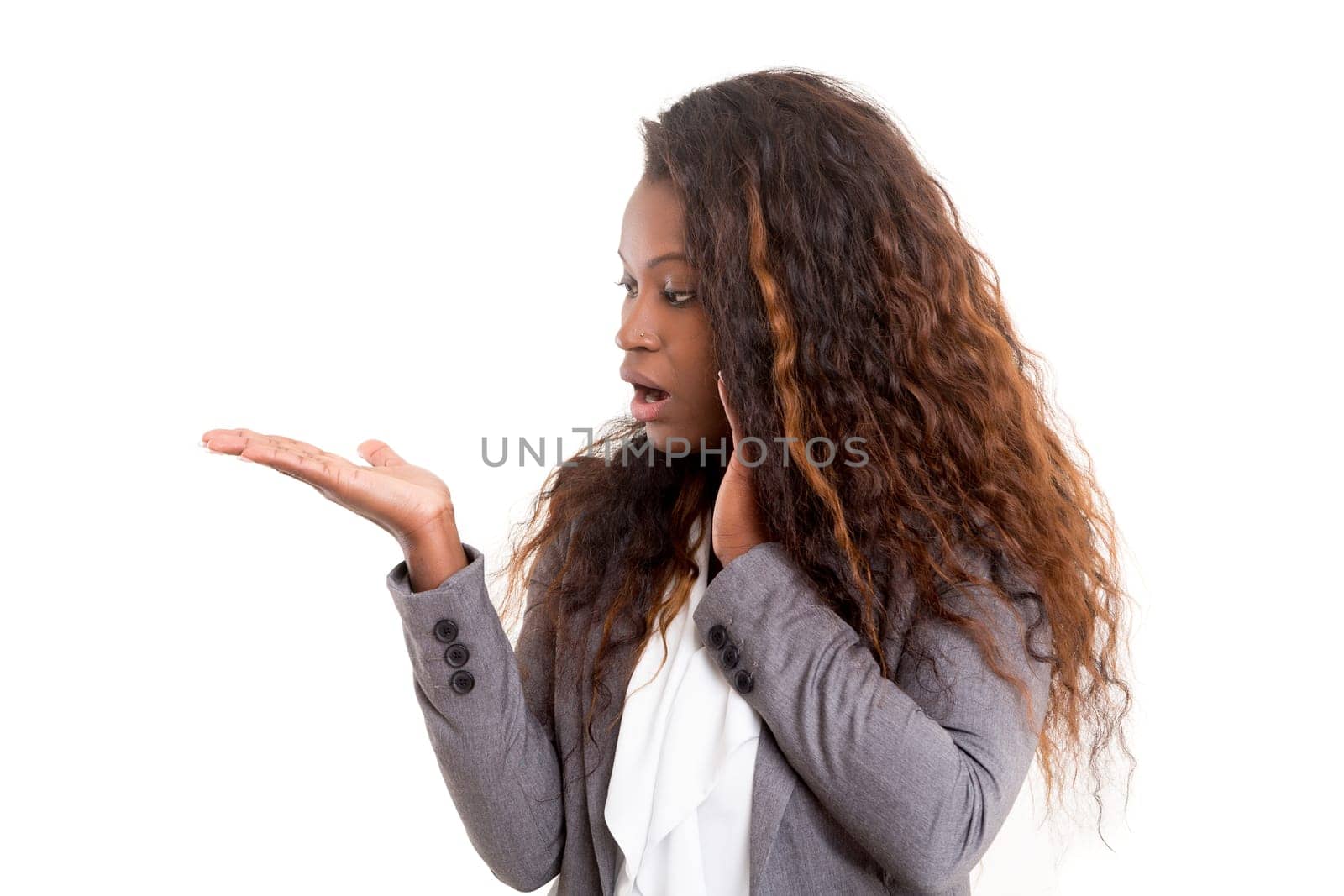 Young beautiful african woman presenting your product, isolated over white background