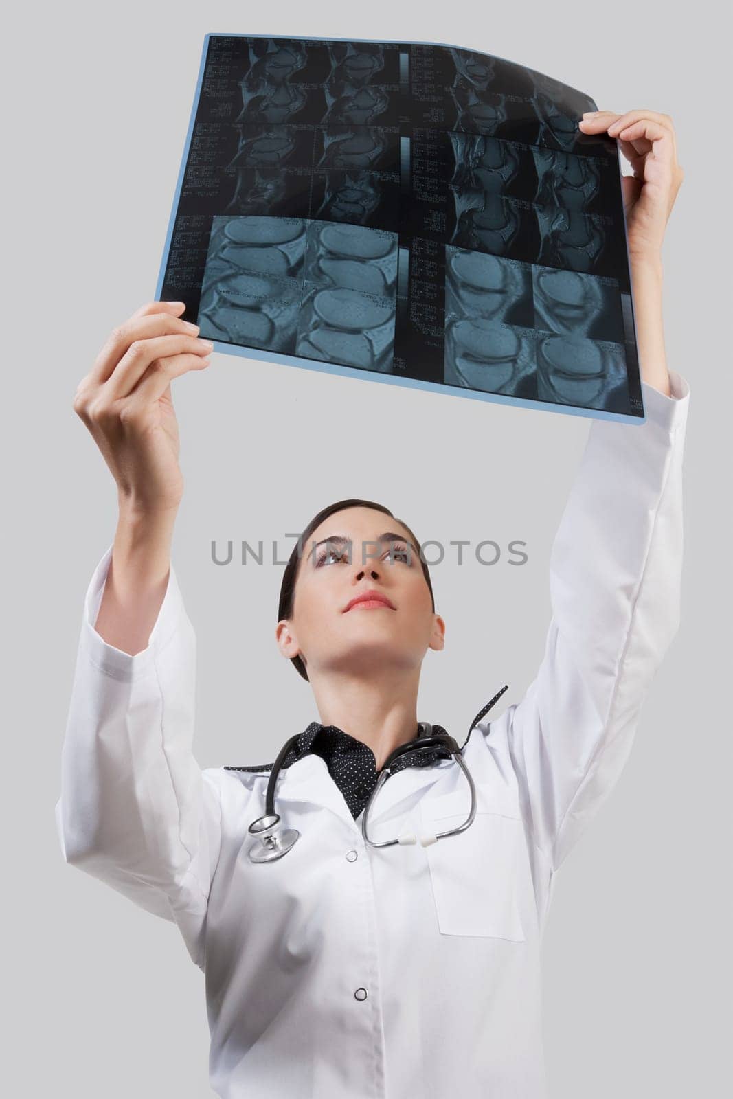 Female doctor examining an x_ray report
