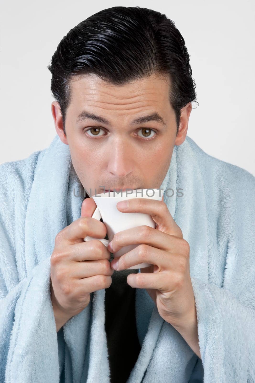 Portrait of a man taking hot drink