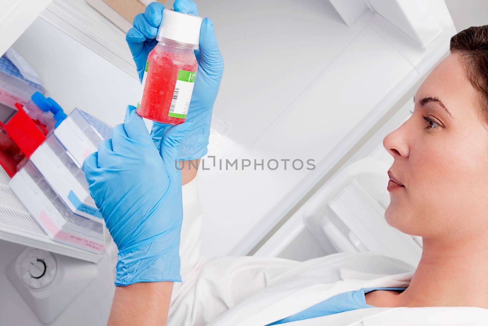 Female doctor holding a bottle of solution in a laboratory