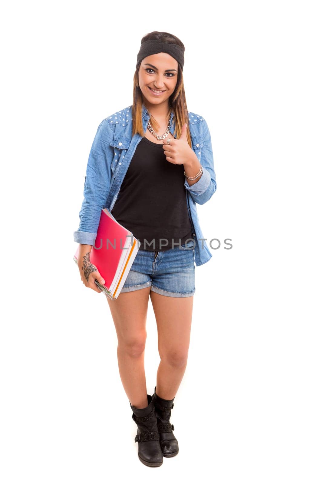 Young student posing over a white background