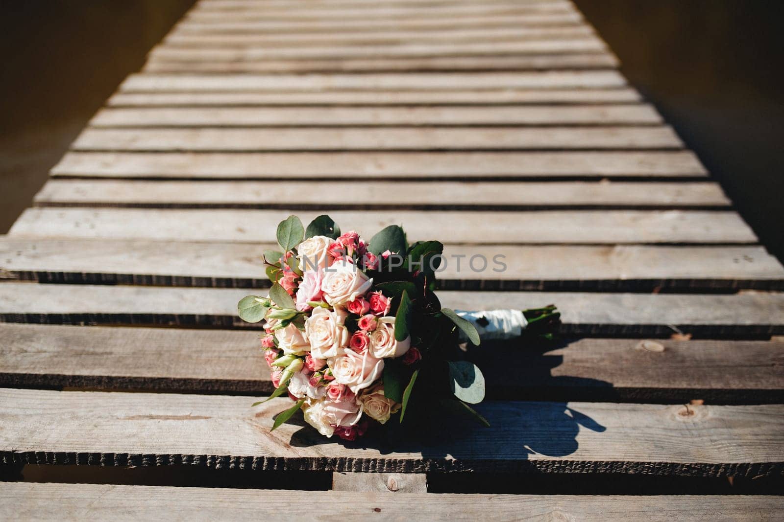 Wedding bouquet on the old wooden terrace. High quality photo