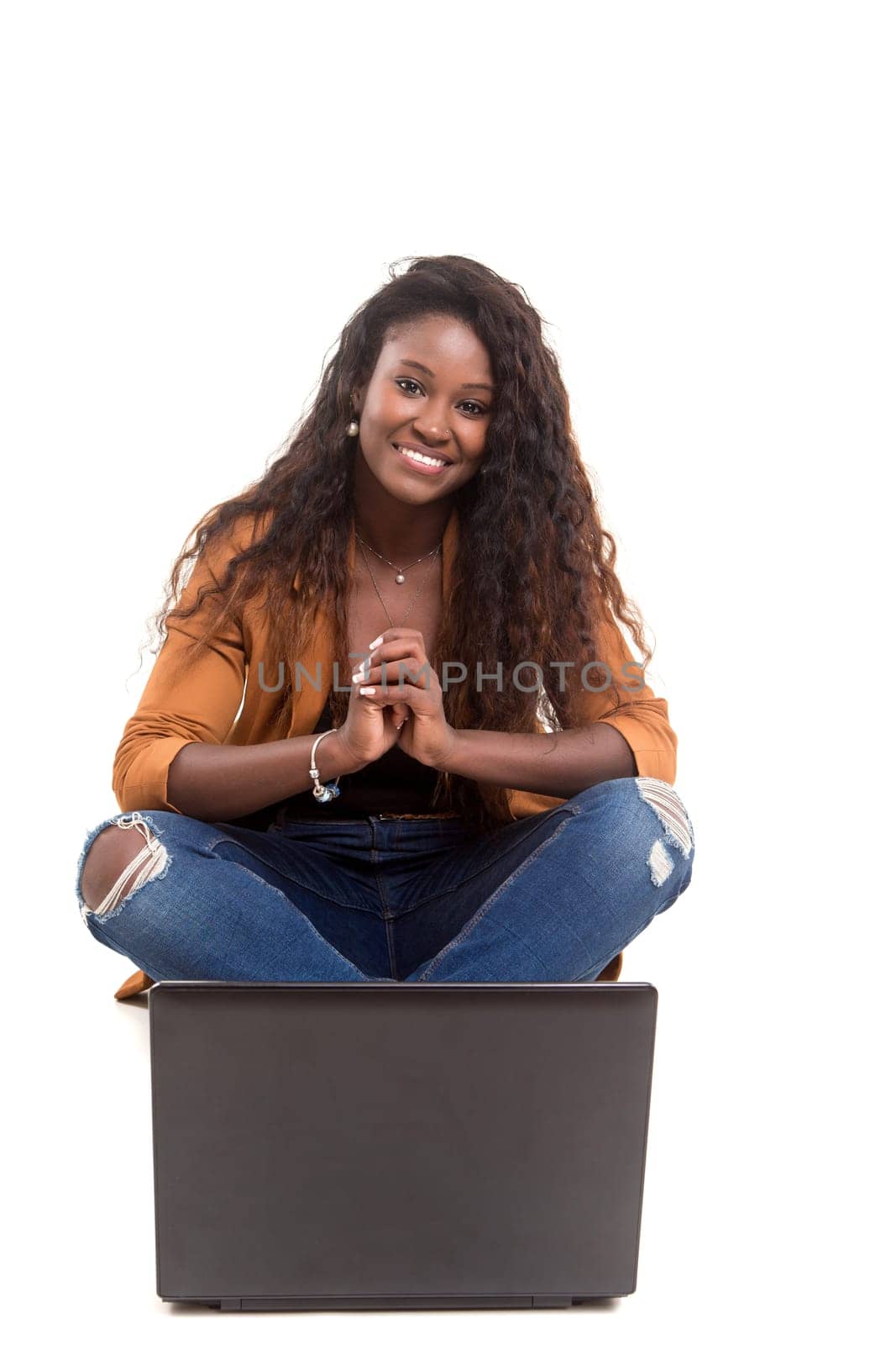 Young african student working with her laptop, isolated over a white background