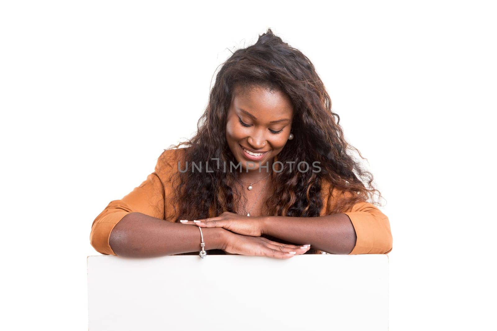 Young beautiful african woman presenting your product, isolated over white background