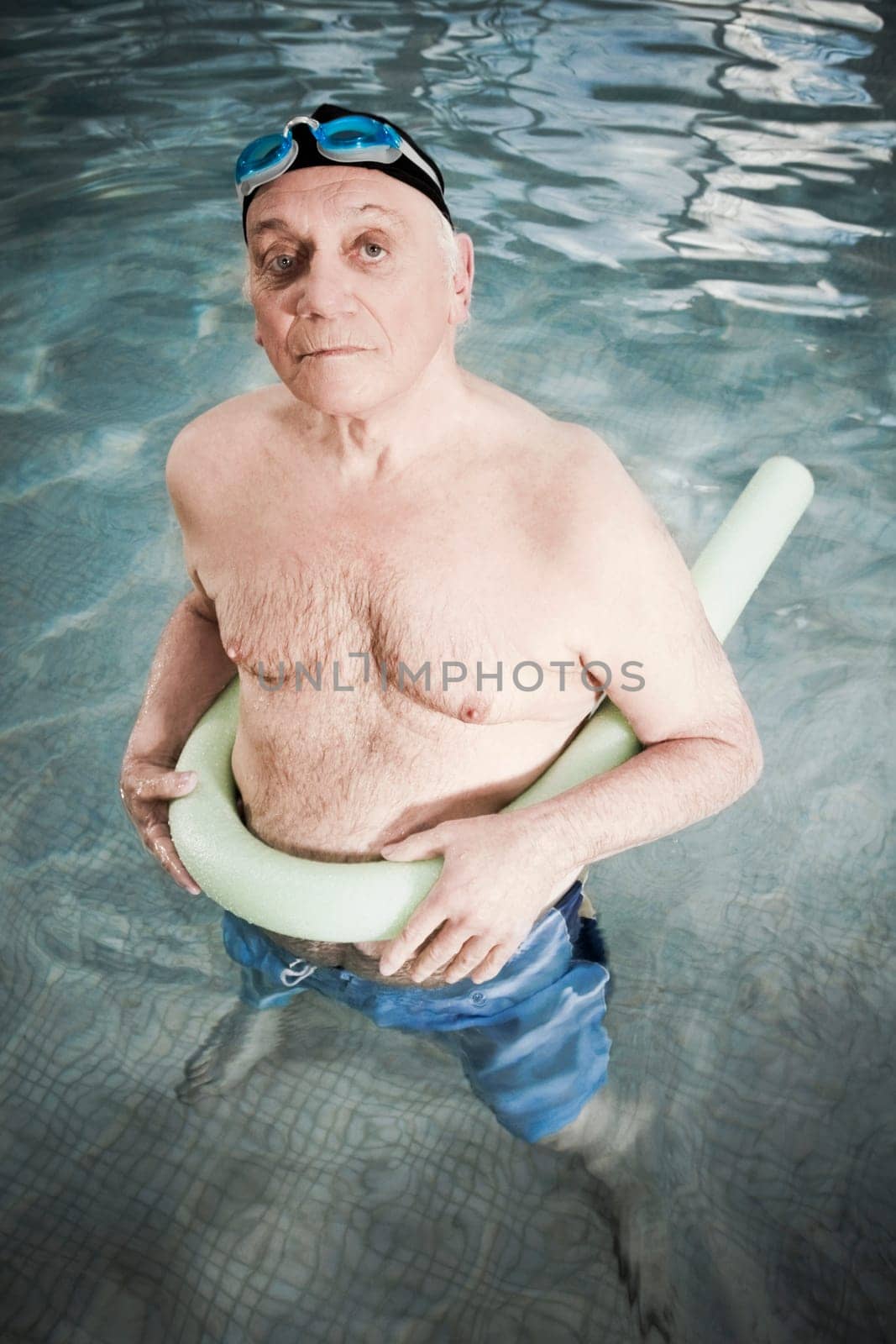 Man using a pool float in a swimming pool
