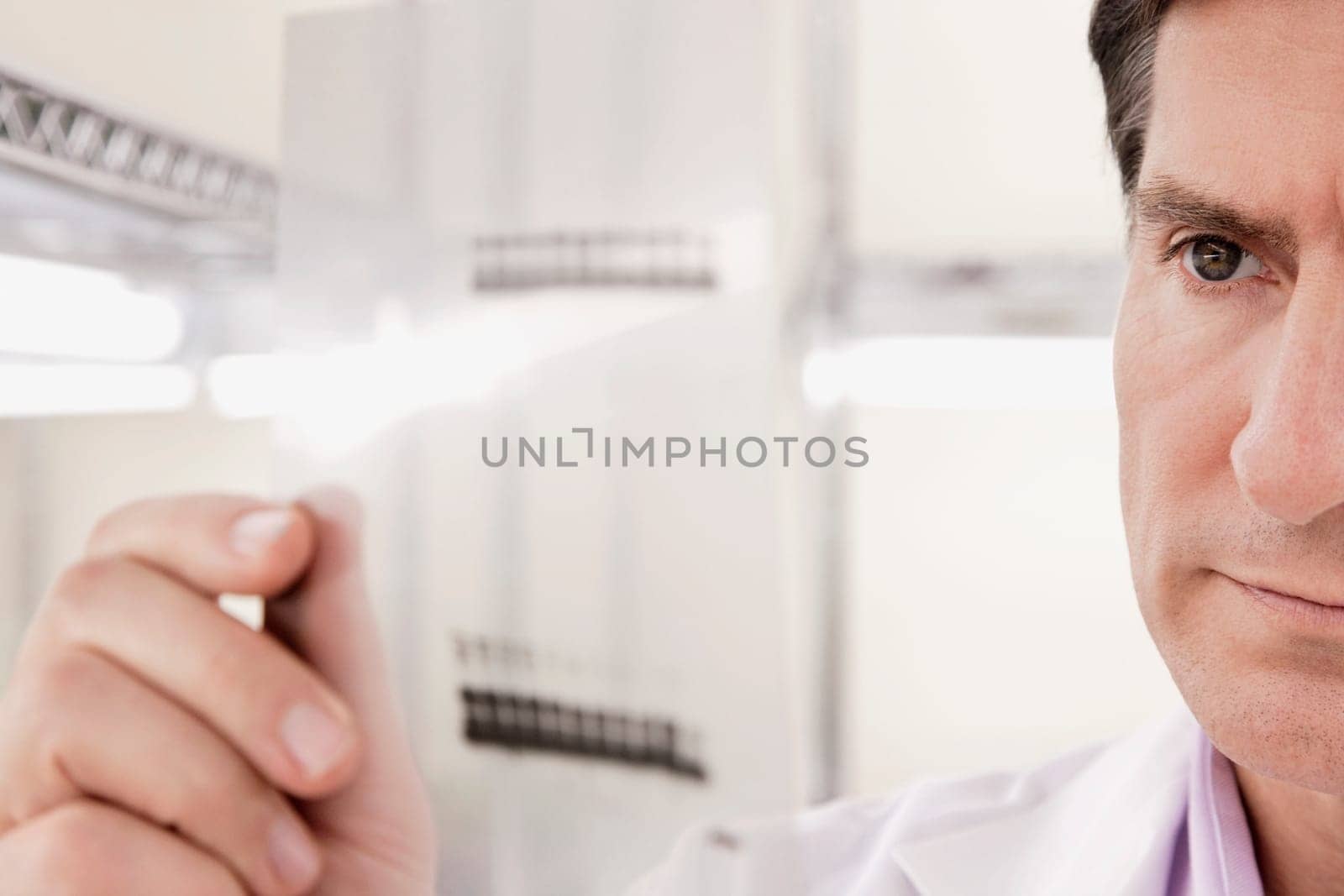Scientist examining a report in a laboratory