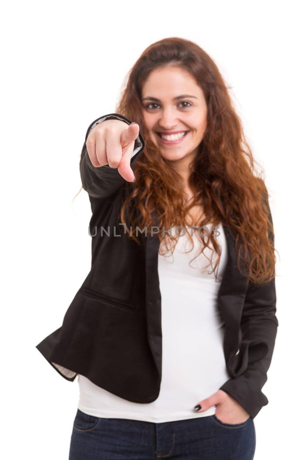 Young beautiful woman pointing at you, isolated over white