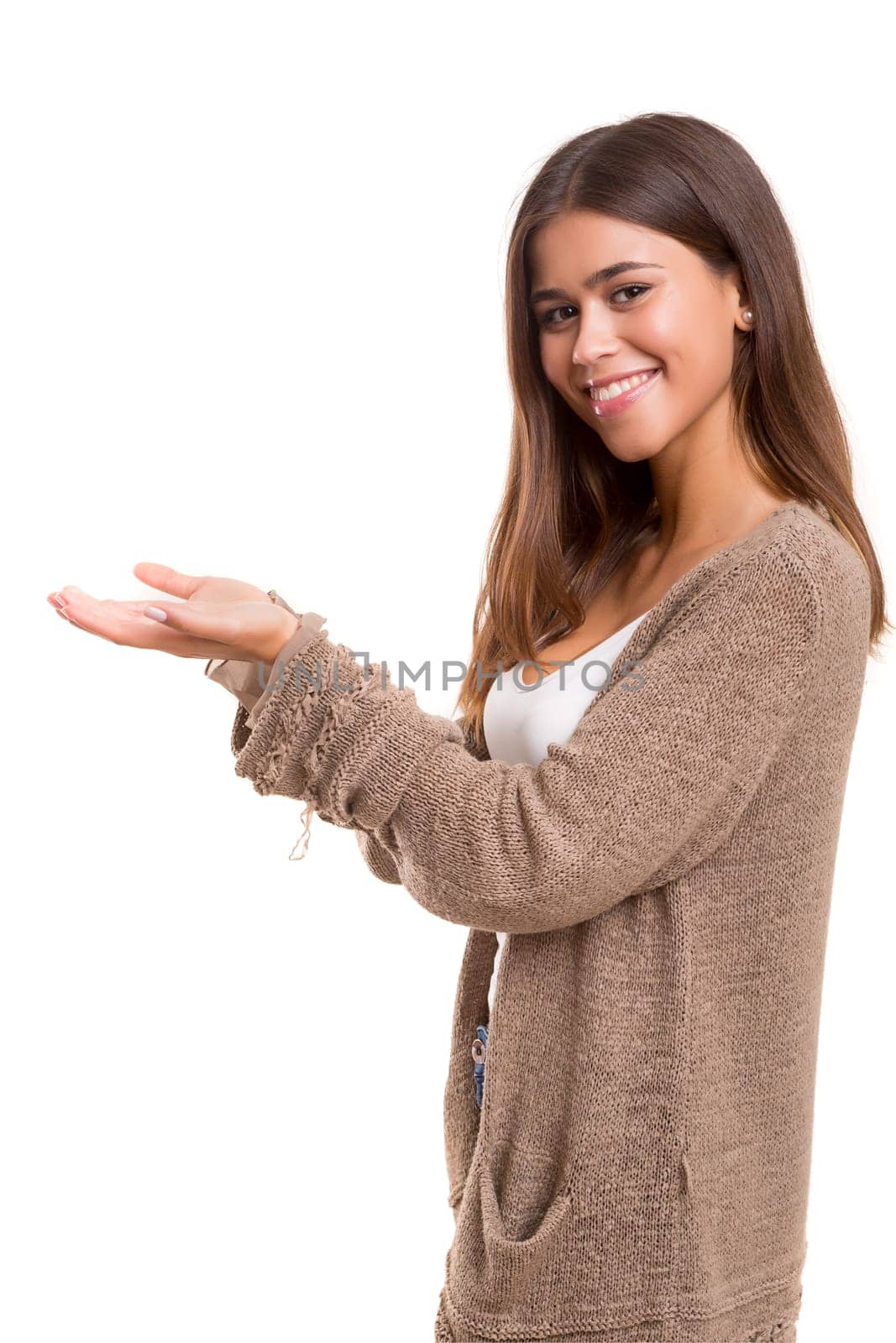 Young beautiful woman presenting your product, isolated over white background