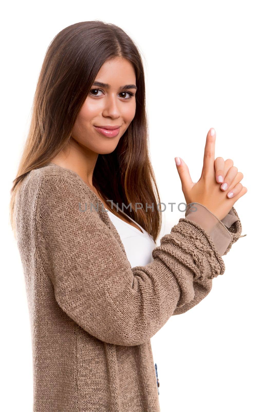 Young woman making a gun with her hands - business concept