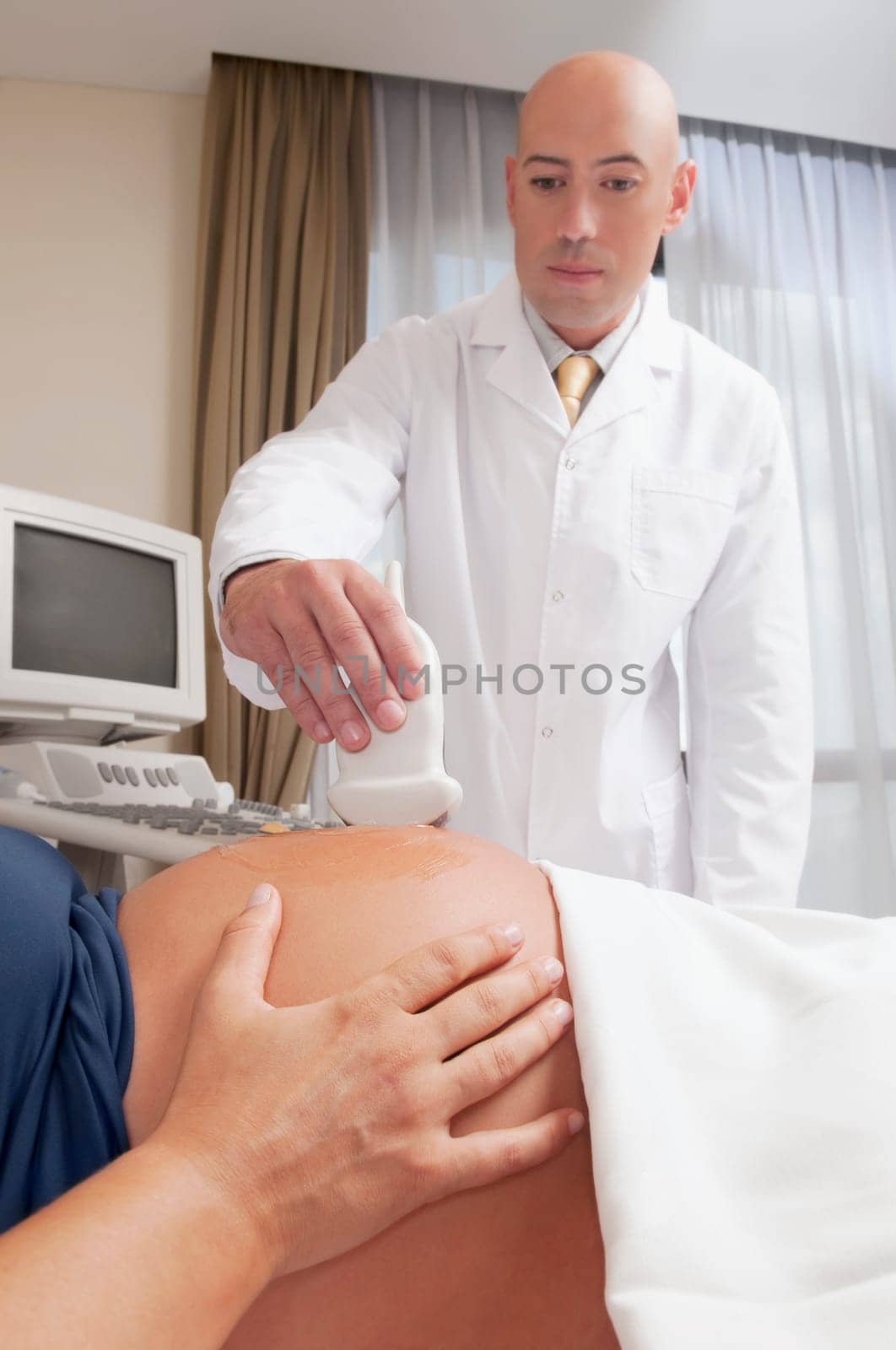 Pregnant woman going through an ultrasound scan