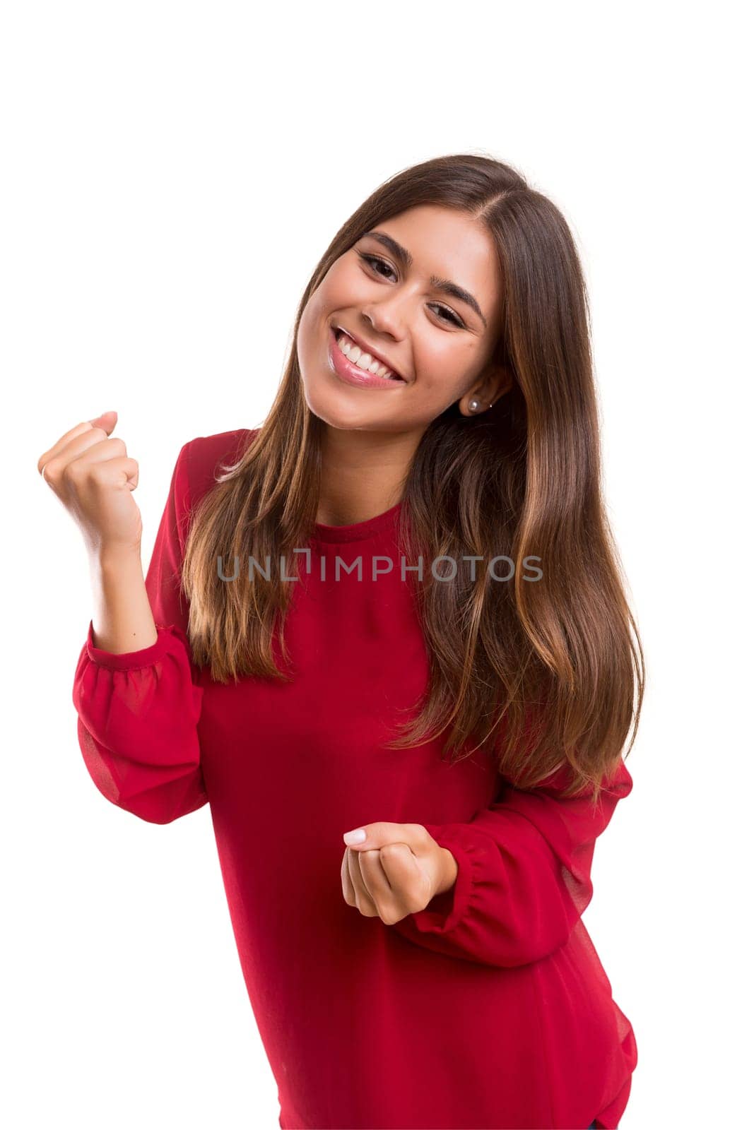 Studio shot: Happy woman with raised arms