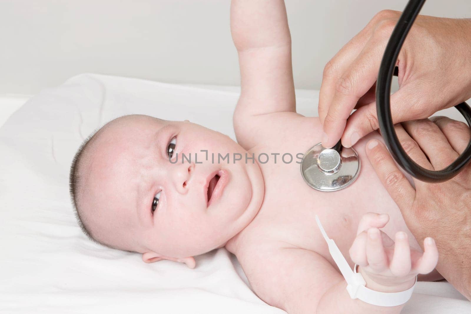 Doctor examining a newborn baby