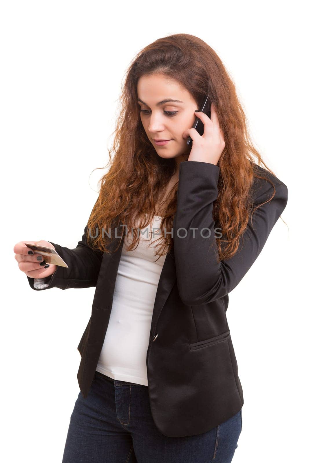 Woman placing an order at the phone with her credit card