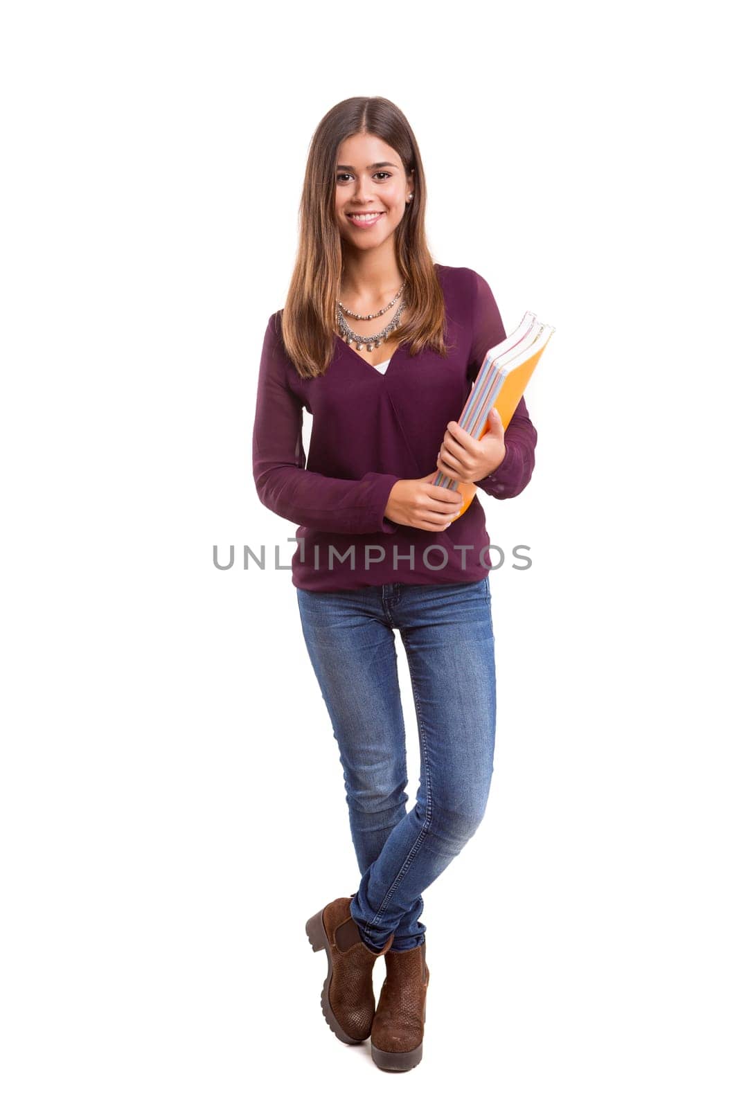 Young student posing over a white background
