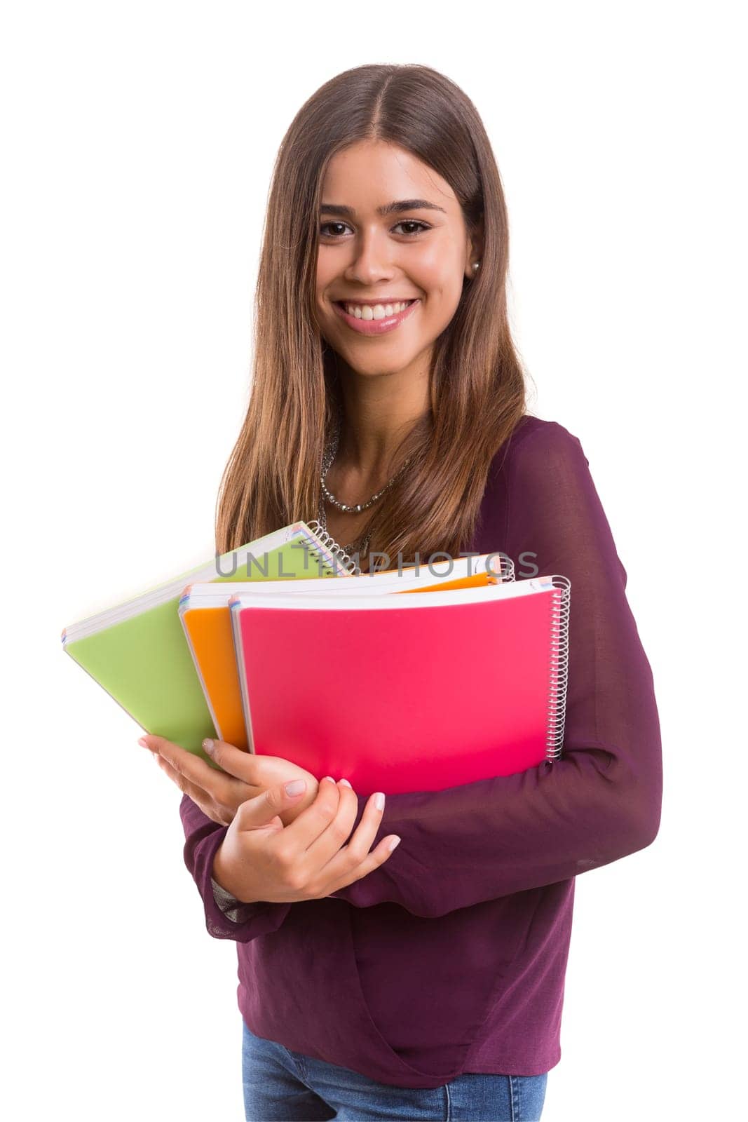 Young student posing over a white background
