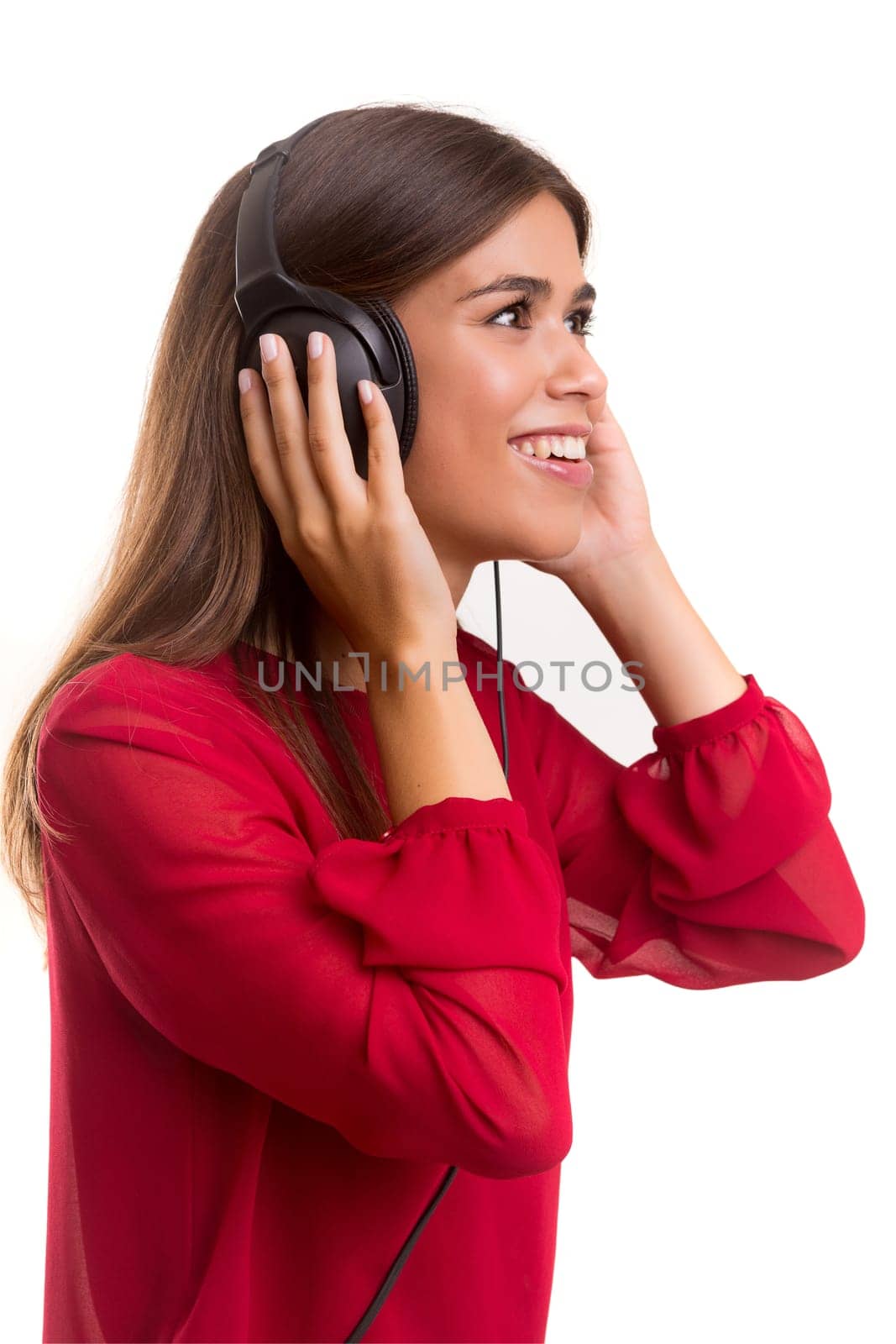 A Happy young woman listening to music