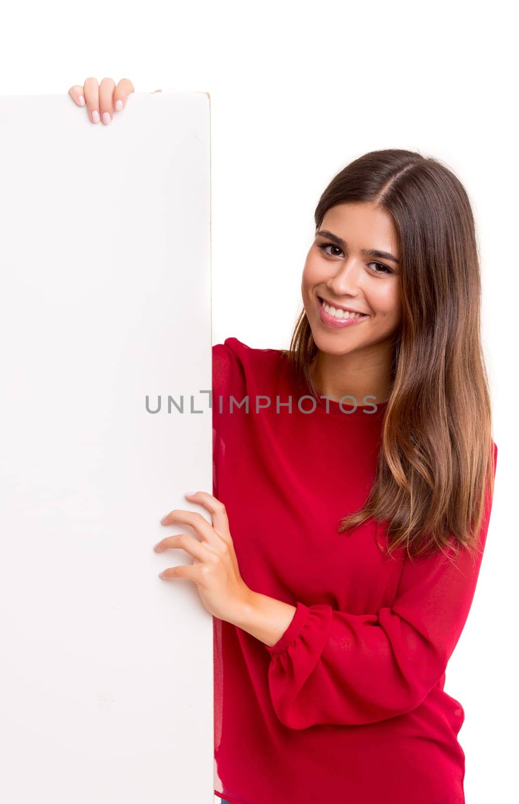 Beautiful young business woman presenting your product on a white card