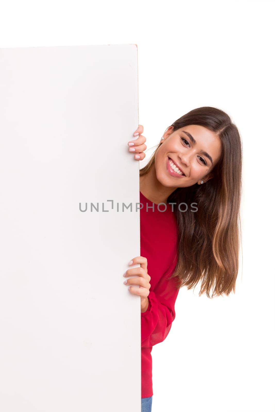 Beautiful young business woman presenting your product on a white card