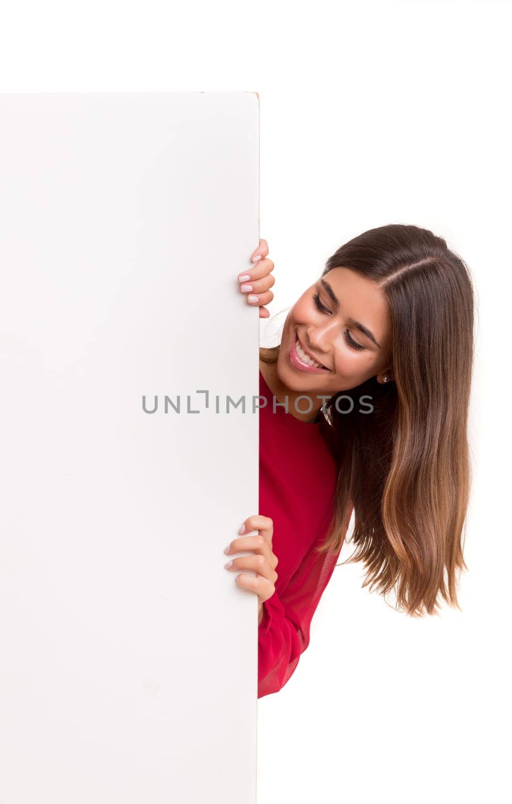 Beautiful young business woman presenting your product on a white card