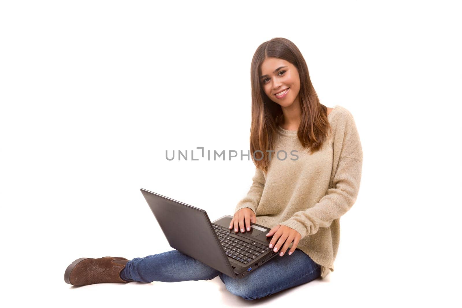Young student working with her laptop, isolated over a white background