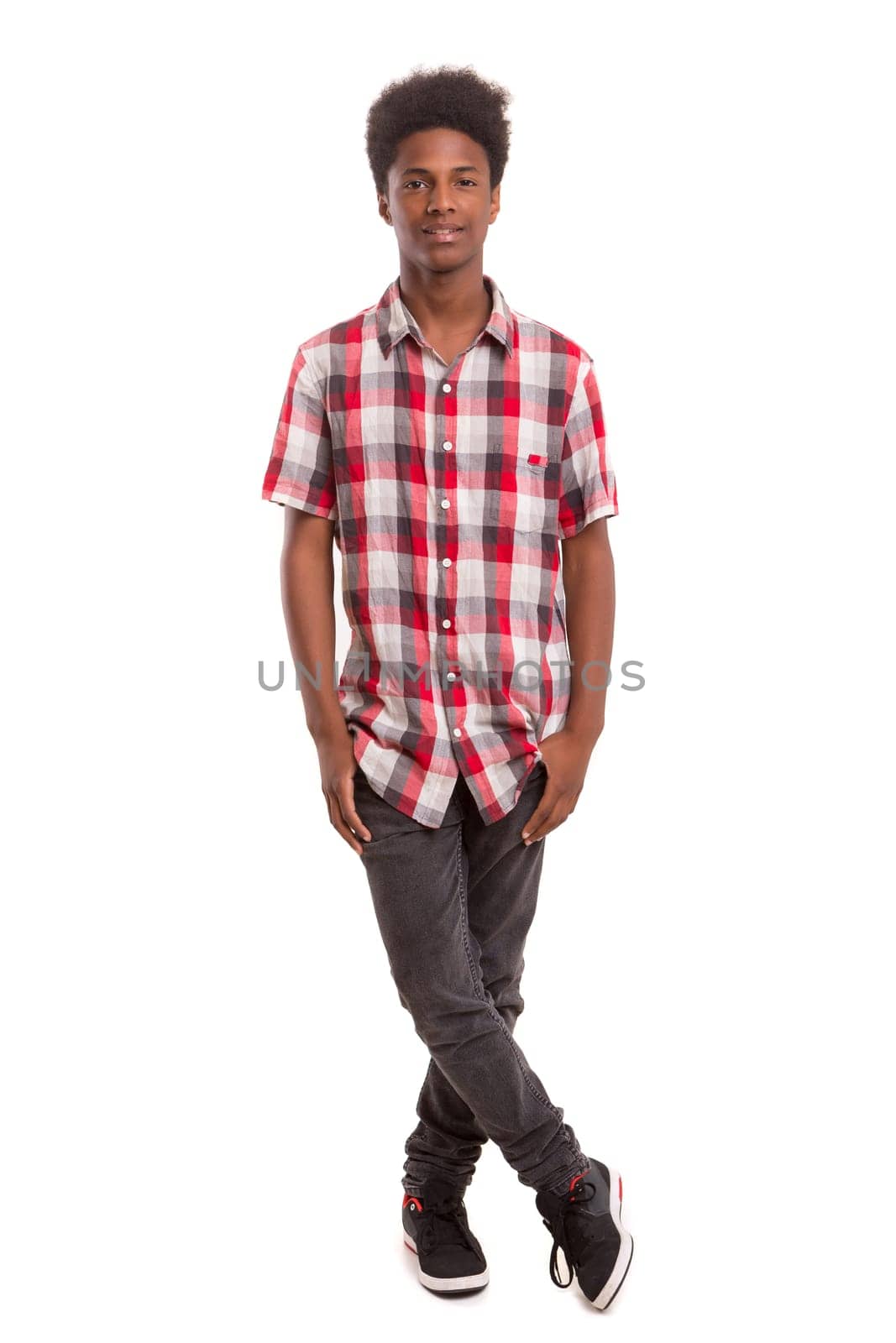 A casual young black boy posing isolated