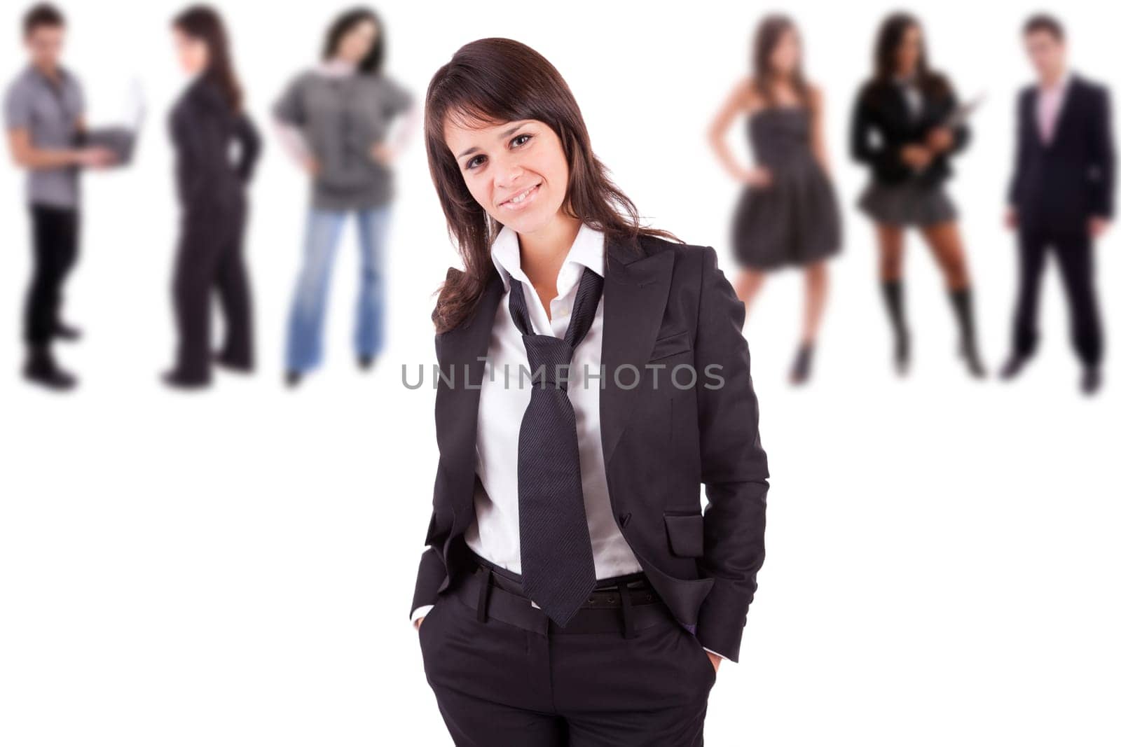 Young engineer posing with some people in the back