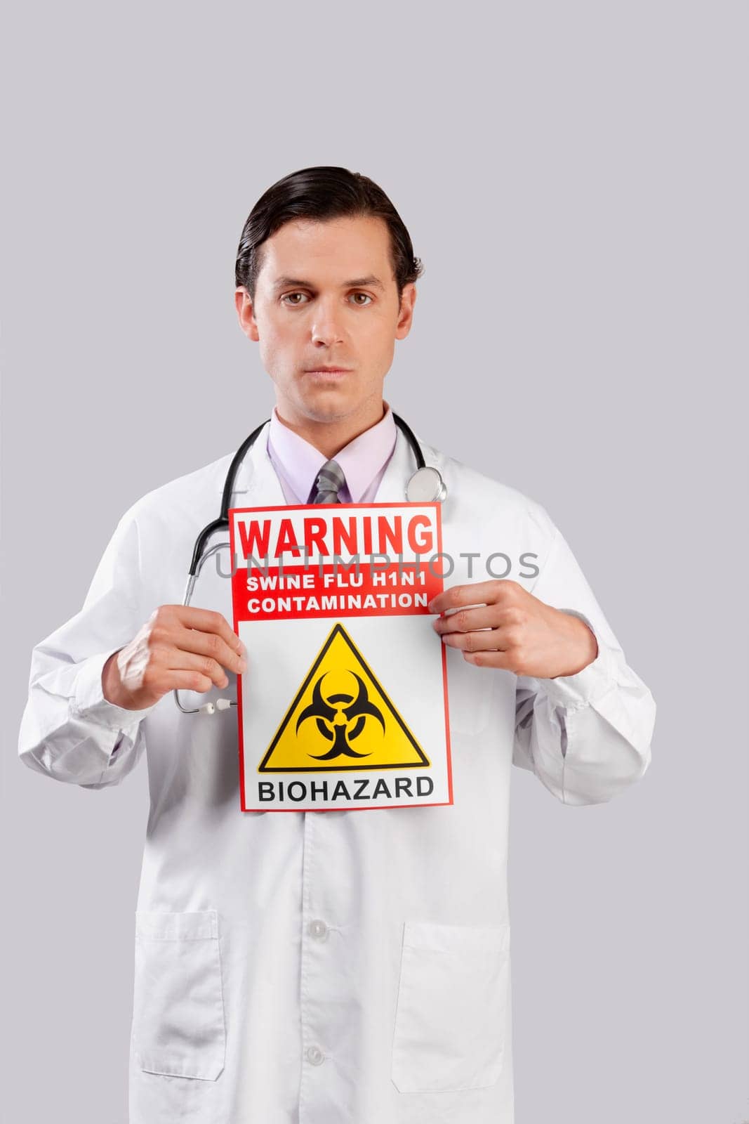 Portrait of a doctor showing a Biohazard warning sign