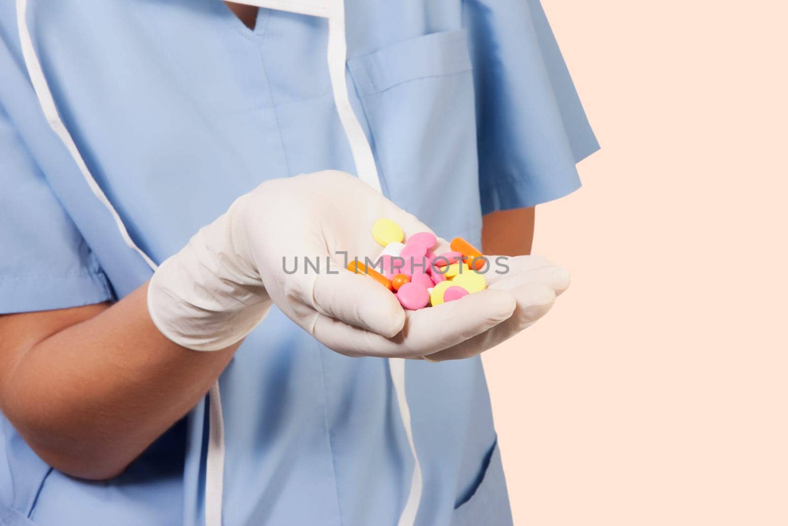 Female doctor showing pills