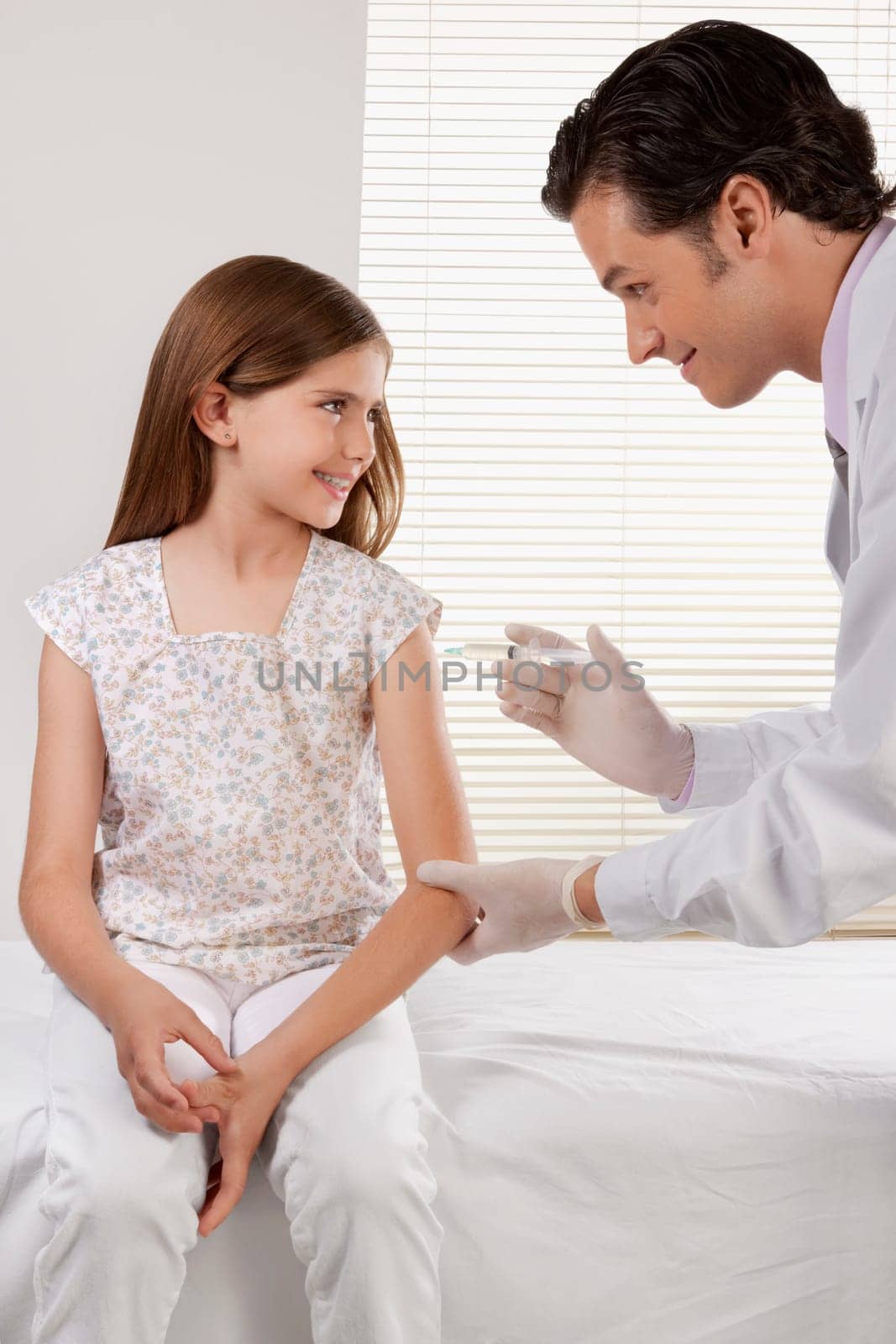 Doctor giving an injecting to a girl